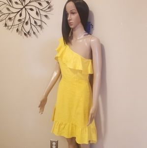 Yellow ruffled shoulder dress.